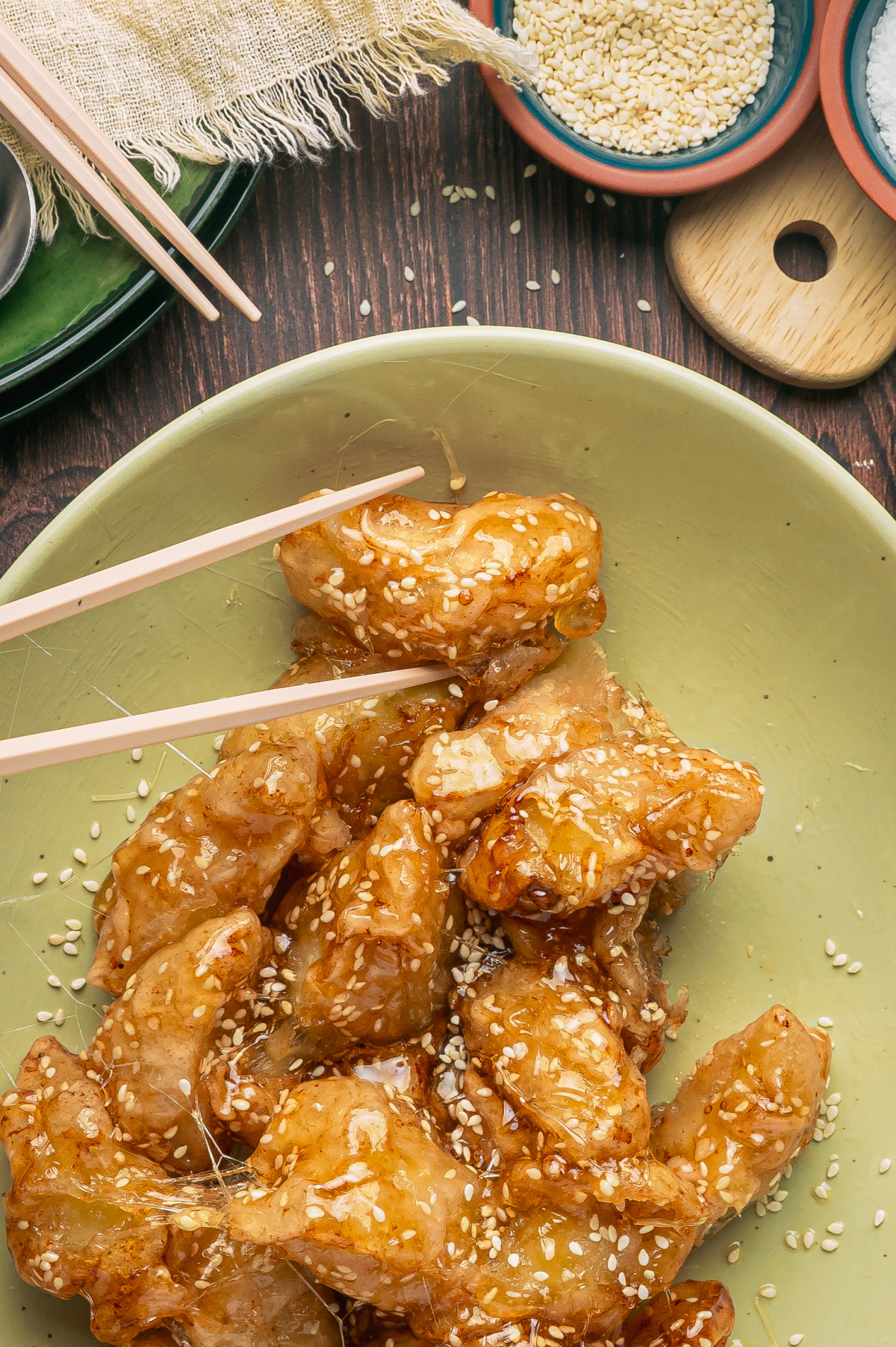 Fried Apples with Sesame Caramel and Pulled Sugar Fried apple pieces coated in brittle sesame caramel with thin strands of pulled sugar