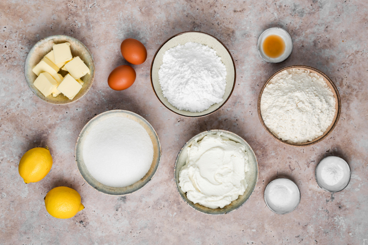 Ingredients for Lemon Ricotta Cookies Ingredients for lemon ricotta cookies including ricotta, fresh lemons, flour, sugar, butter and eggs